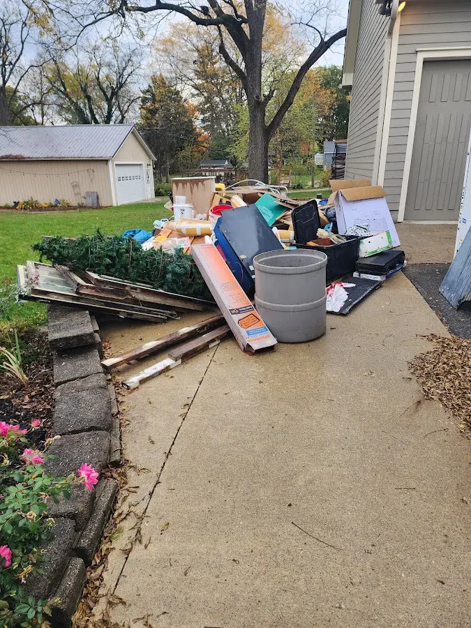 Dumpster being loaded with debris for Residential Dumpster Rental in Waco